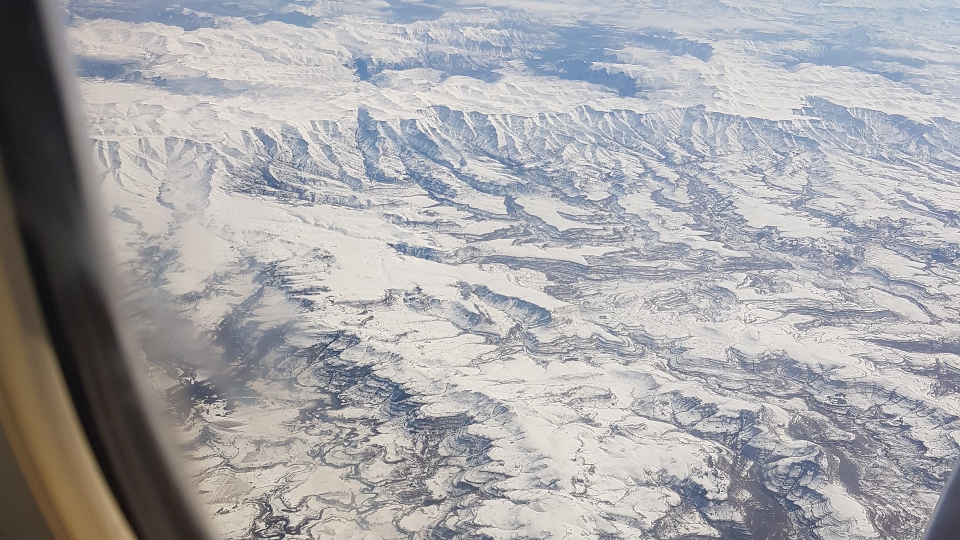 Aerial view of the snow-capped Drakensberg mountain range