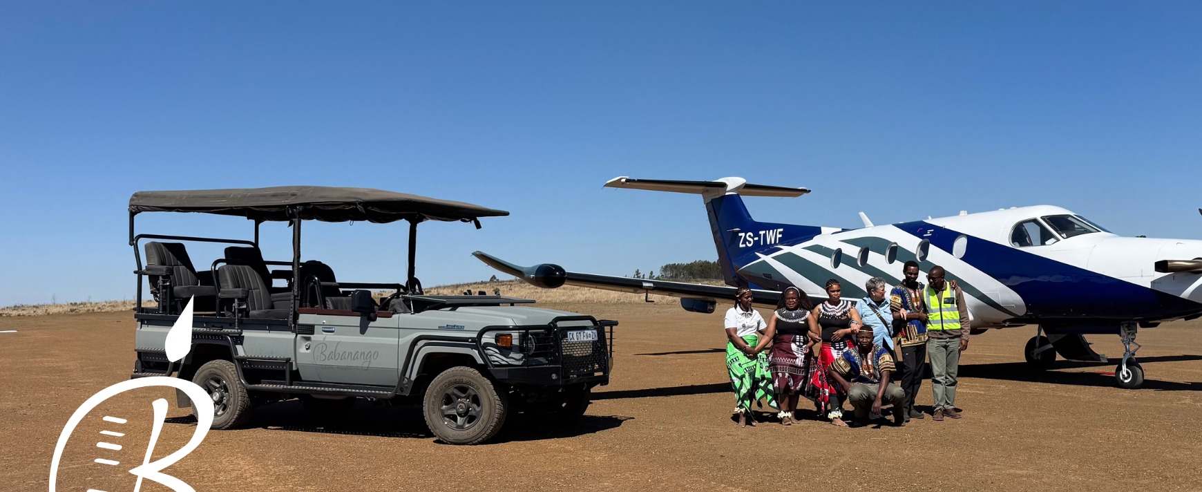 Babanango Game Reserve safari vehicle beside a Pilatus PC-12 aircraft on Eagle’s View Airstrip, Zululand